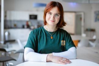 young woman on a table smiling